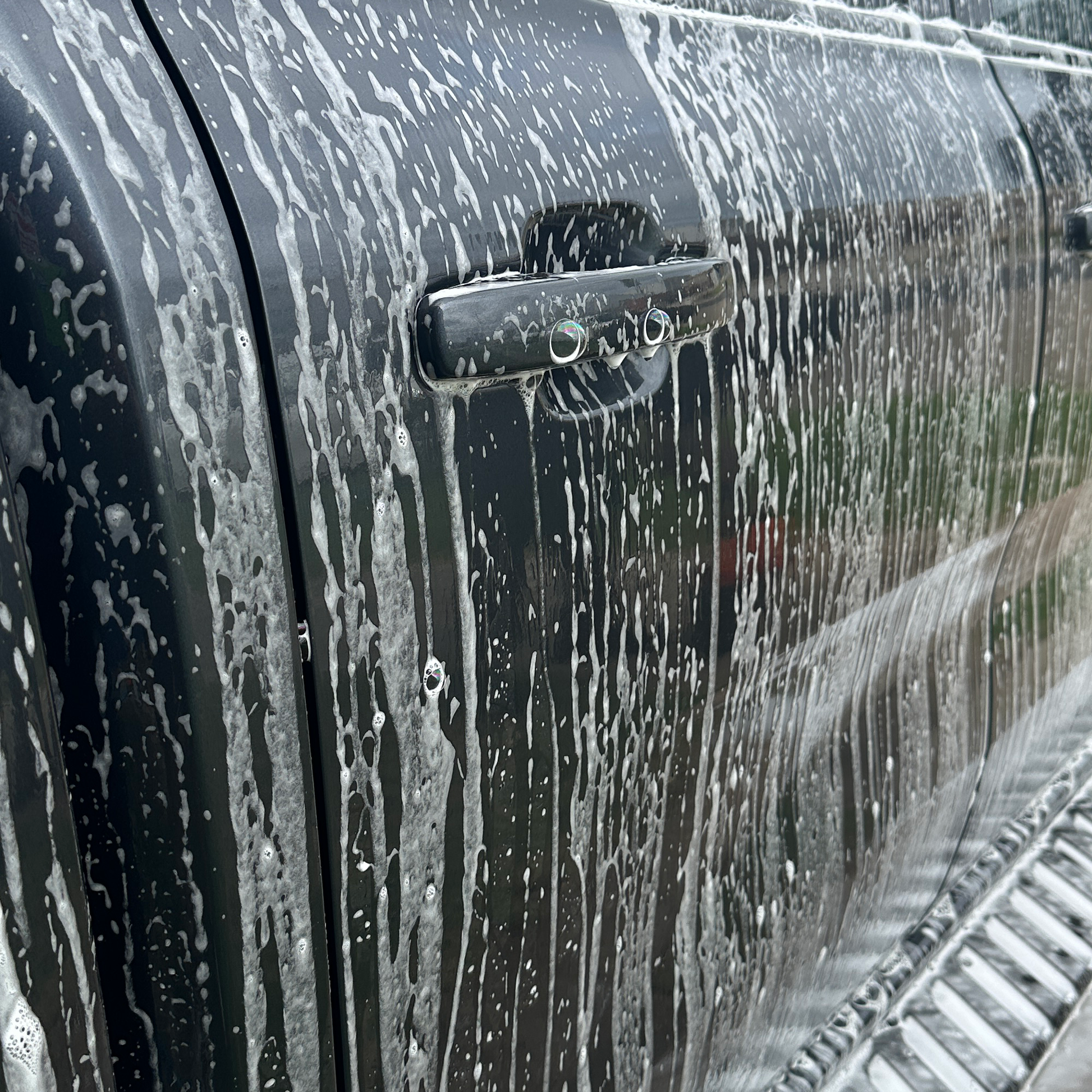4x4 cleaner foaming on the side of a vehicle