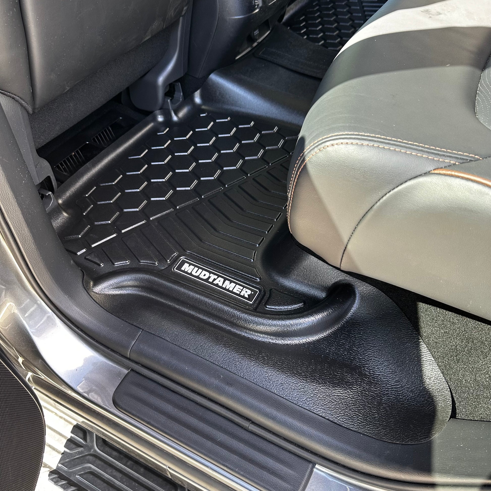 Rear set of MUDTAMER floor mats installed in a Nissan Y62 Patrol