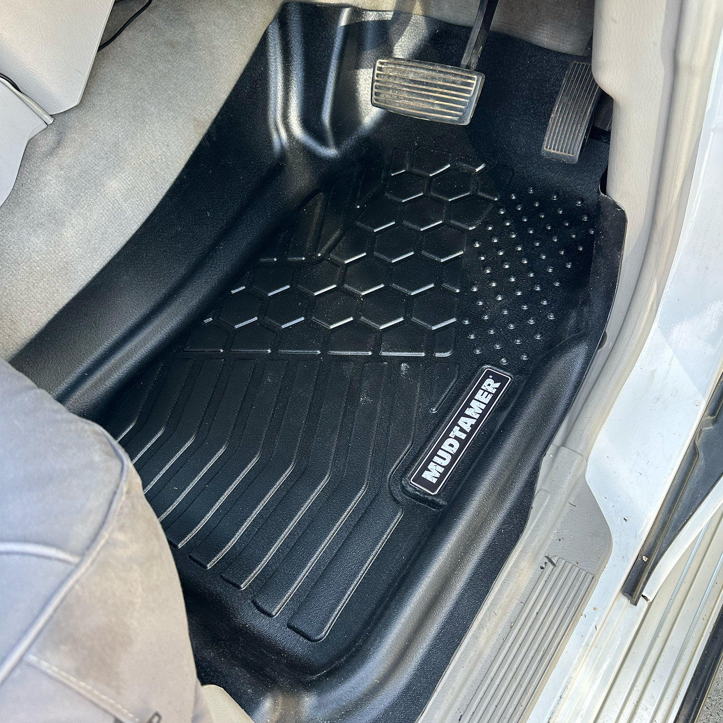 MUDTAMER driver side floor mat installed in a Nissan GU Patrol