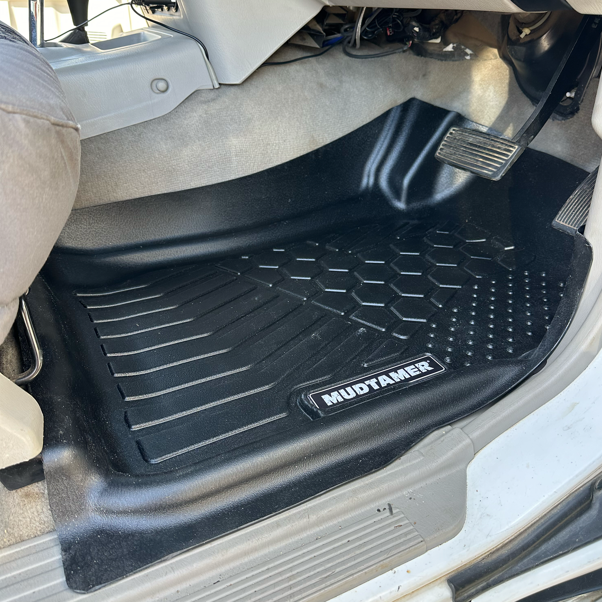 MUDTAMER driver's side floor mat installed in a Nissan GU Patrol