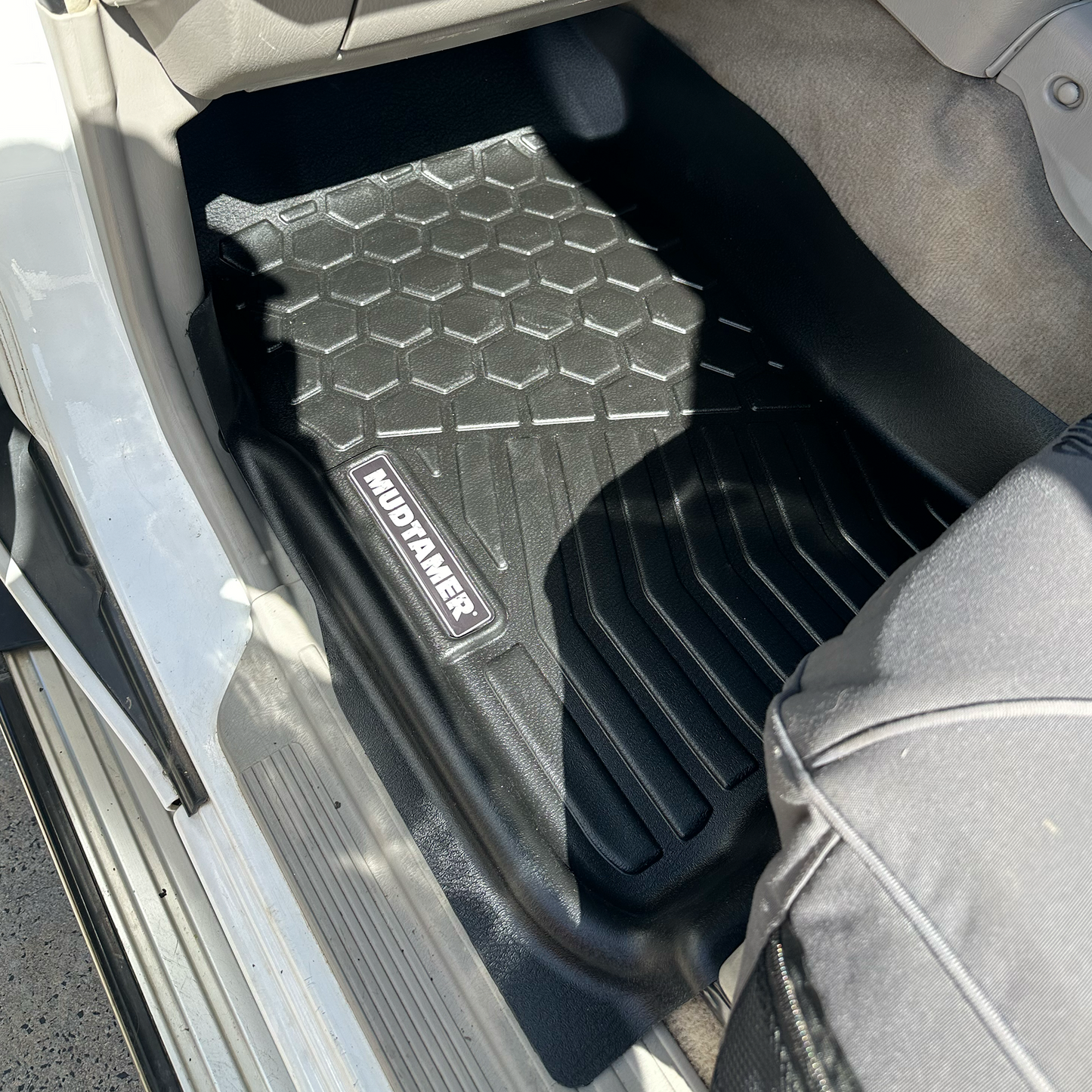 MUDTAMER passenger floor mat installed in a Nissan GU Patrol