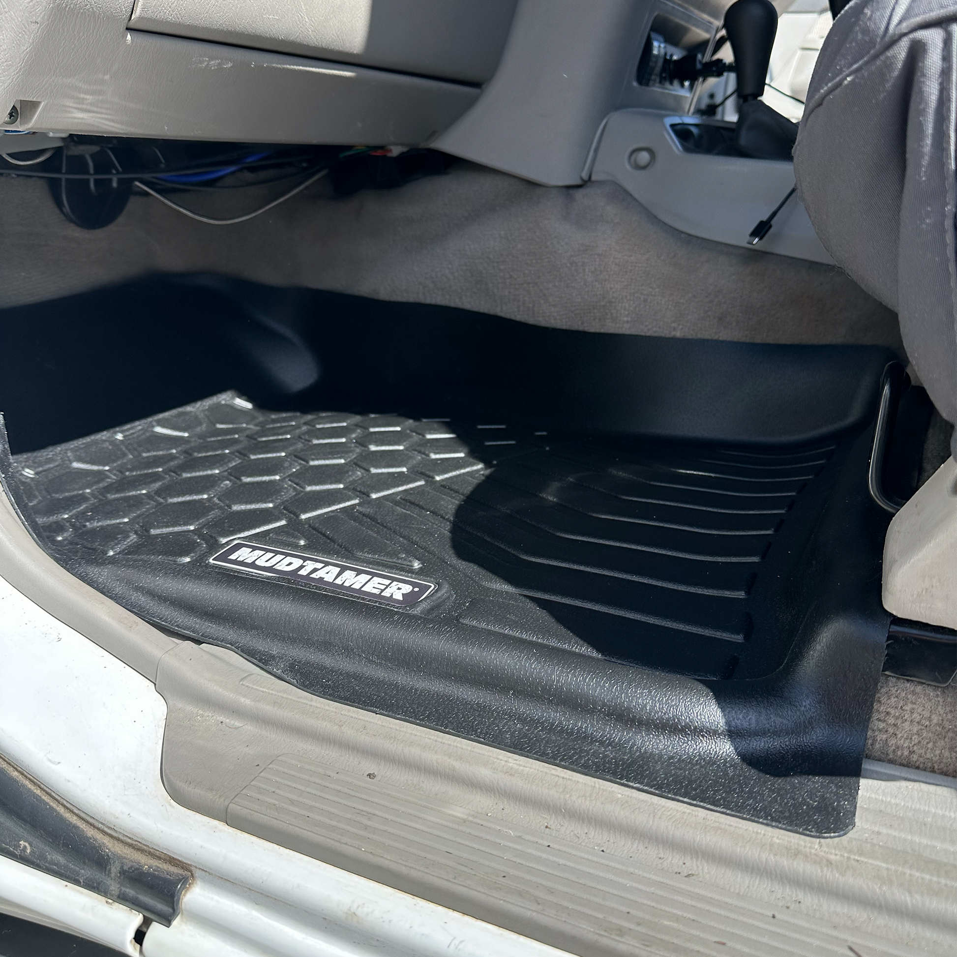 MUDTAMER passenger floor mat installed in a Nissan GU Patrol