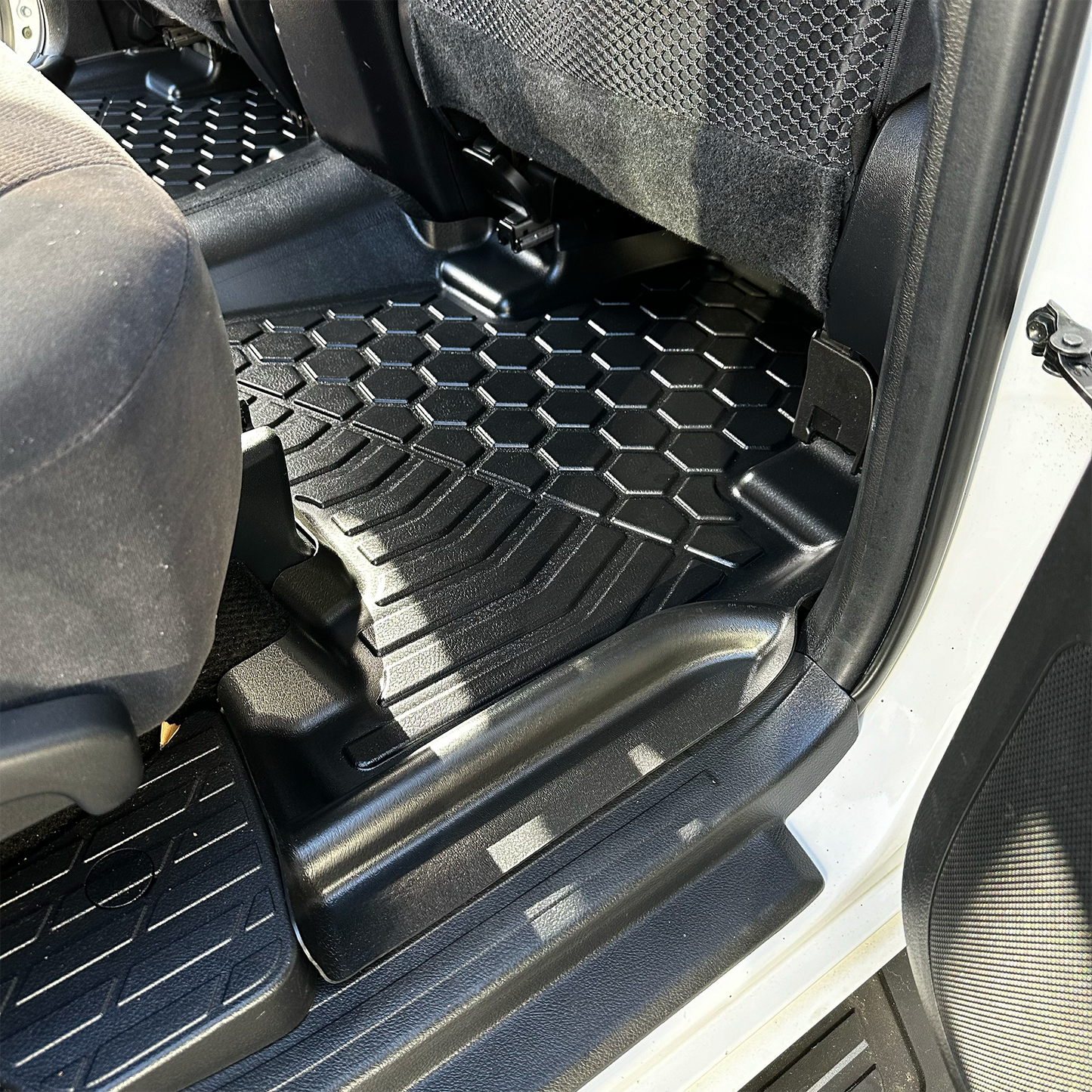 Rear set of MUDTAMER floor mats installed in a Toyota Prado 150