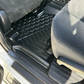 Rear set of MUDTAMER floor mats installed in a Toyota Prado 150