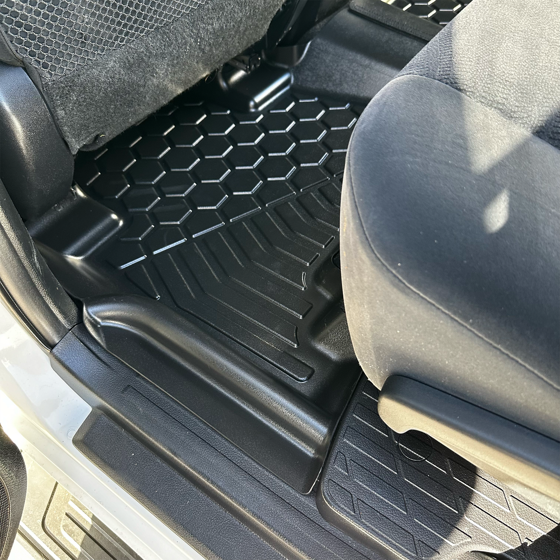 Rear set of MUDTAMER floor mats installed in a Toyota Prado 150