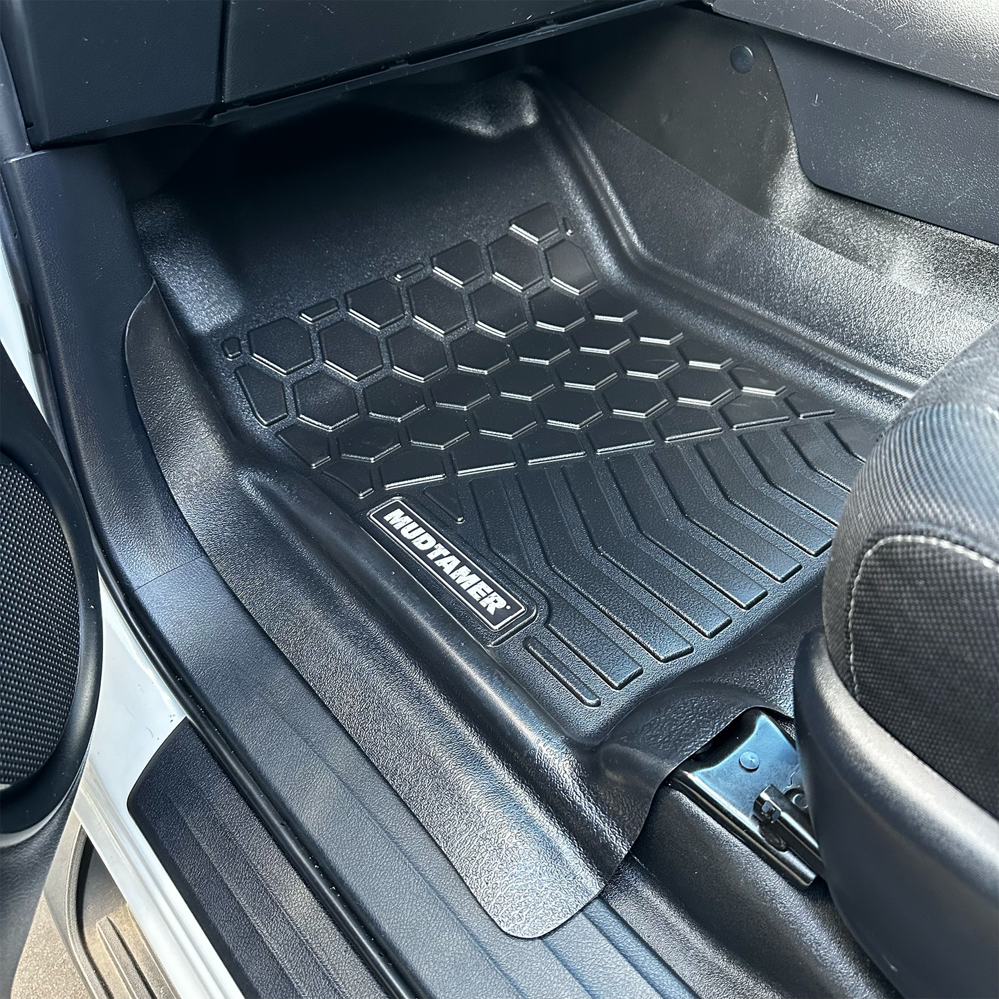 Front passenger MUDTAMER floor mat installed in a Toyota Hilux