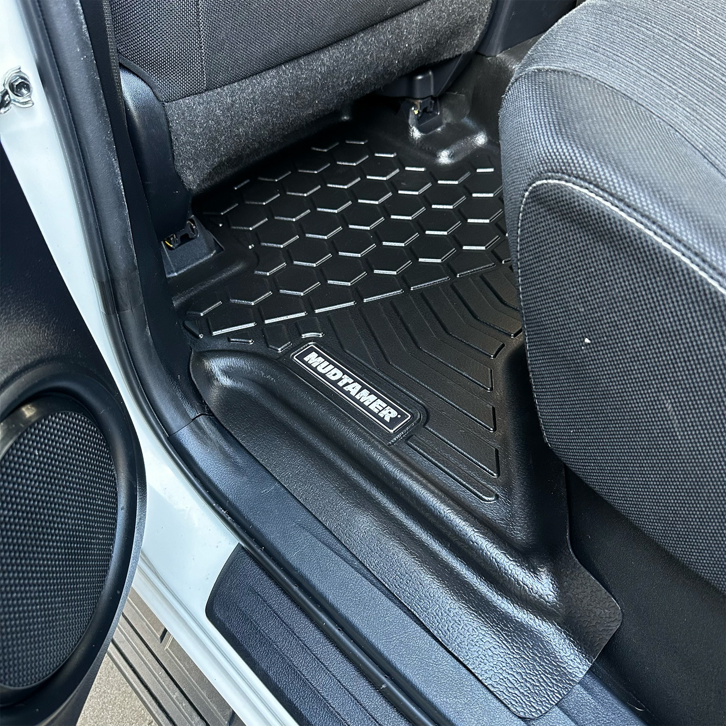 Rear set of MUDTAMER mats installed in a Toyota Hilux