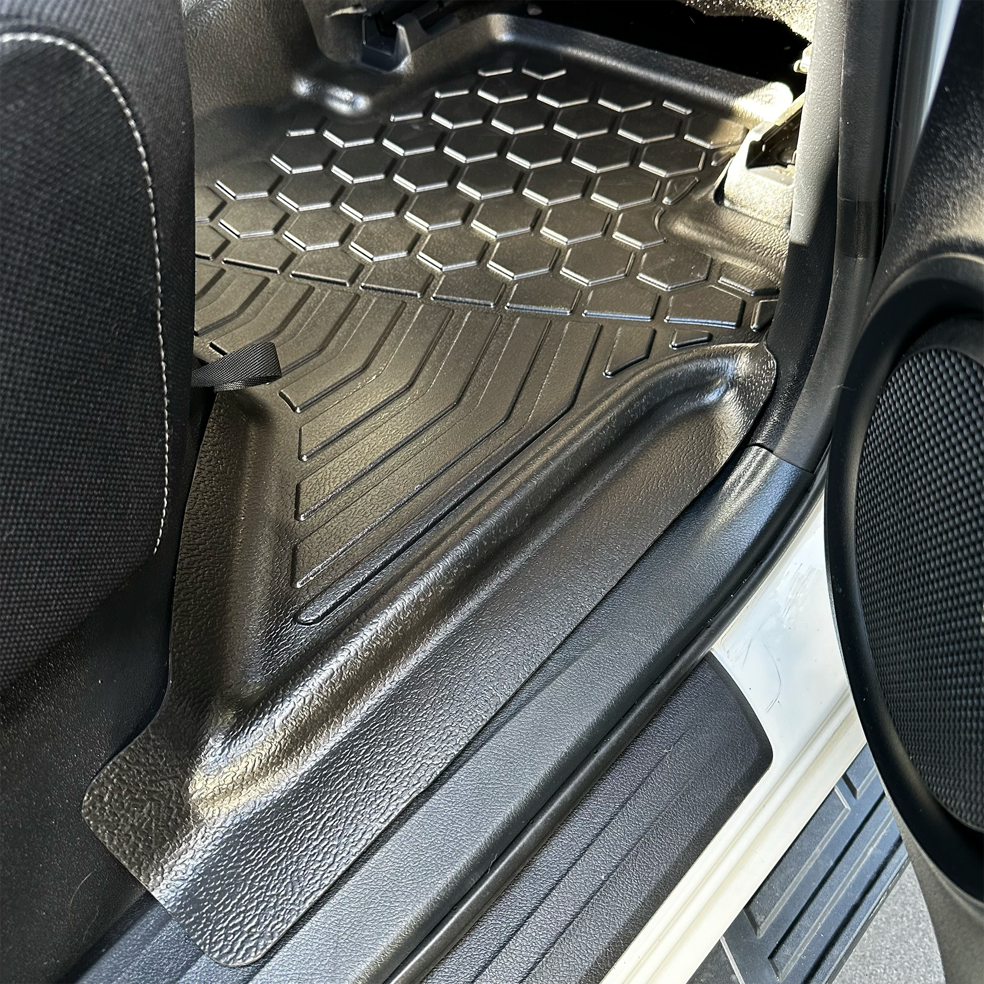 Rear set of MUDTAMER floor mats installed in a Toyota Hilux