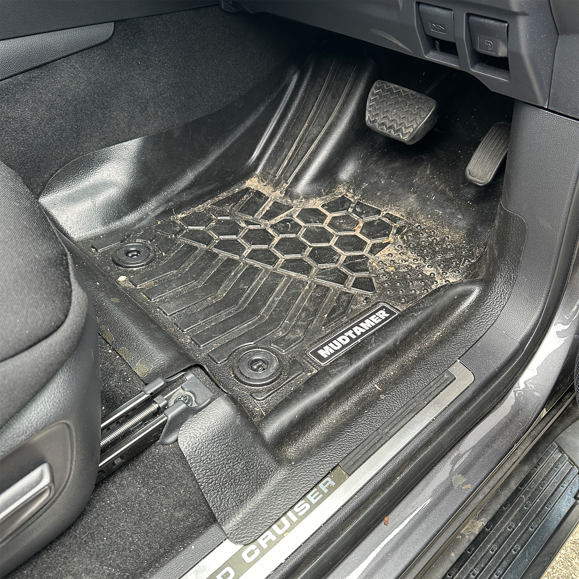 Front driver's side MUDTAMER floor mat for a Toyota Landcruiser 300 Series installed in the vehicle